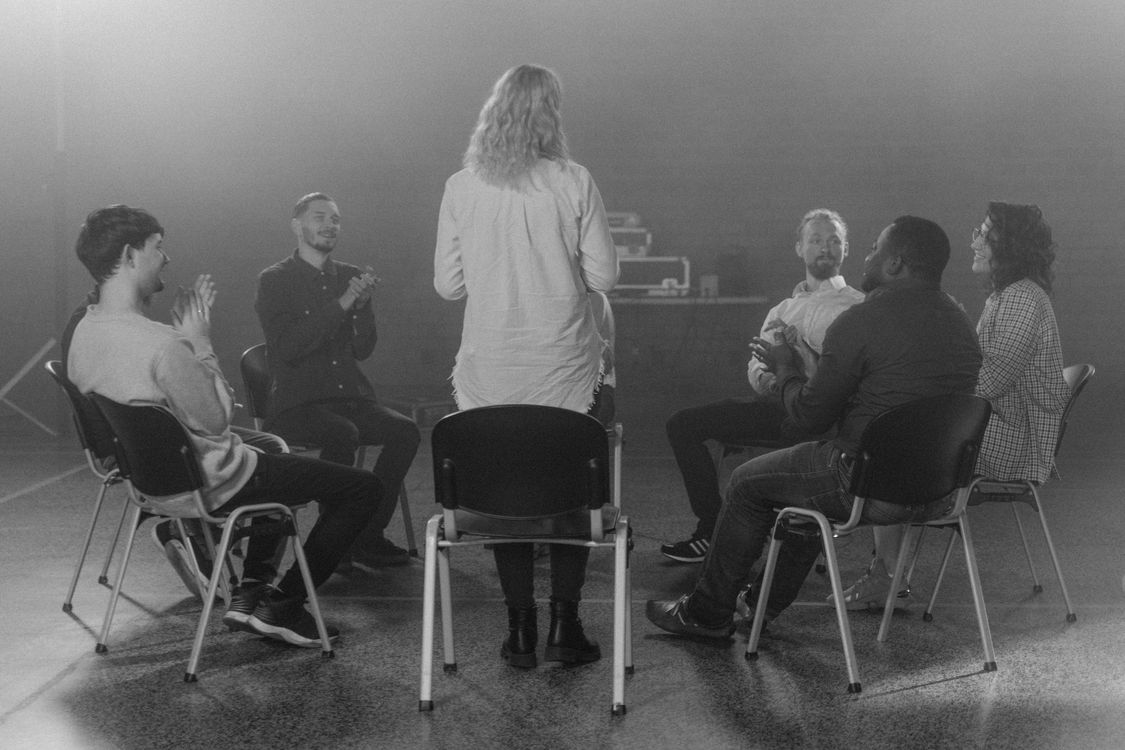 A group sitting together in a circle of chairs
