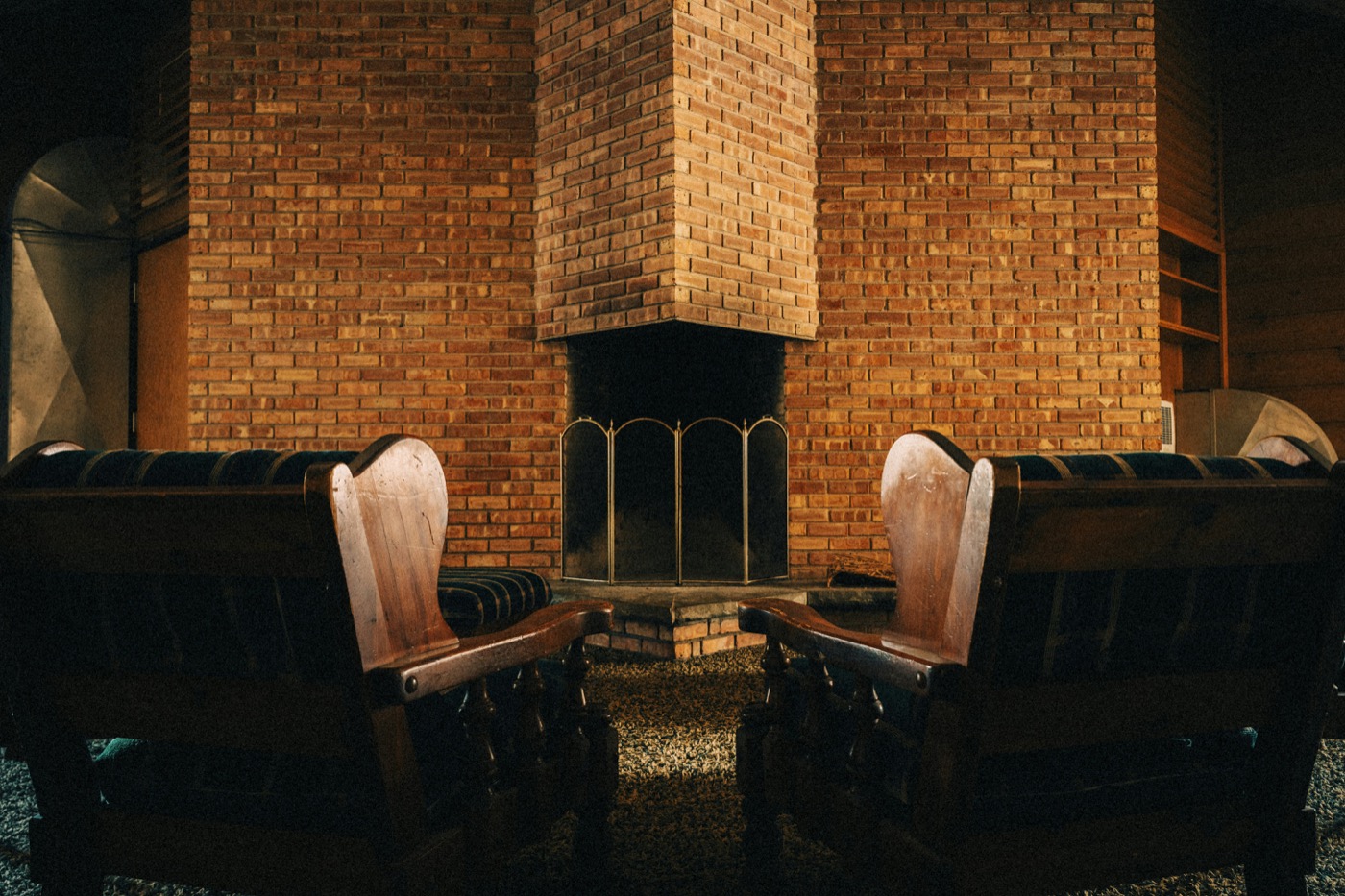 Two chairs facing each other in a warmly lit room